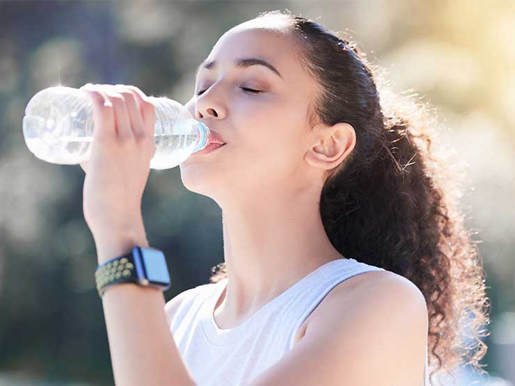 image of woman drinking water